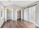 Bright bedroom with double closets and sliding barn door to bathroom at 603 Canadice Rd, Huntersville, NC 28078