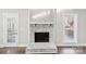 Whitewashed brick fireplace with a wood mantel at 603 Canadice Rd, Huntersville, NC 28078