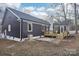 Rear view of the house, showcasing a new deck and landscaping at 603 Canadice Rd, Huntersville, NC 28078