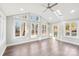 Sunroom addition features multiple windows and a ceiling fan at 603 Canadice Rd, Huntersville, NC 28078