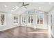 Bright sunroom with abundant natural light and wood flooring at 603 Canadice Rd, Huntersville, NC 28078