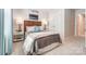 Bedroom features a large window, wooden headboard, and stylish decor at 608 Cassidy Ct, Clover, SC 29710