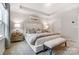 Beautifully staged main bedroom with a plush bed, neutral tones, tray ceiling, and comfortable furnishings at 608 Cassidy Ct, Clover, SC 29710