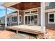 Back porch features a stained wood ceiling with views of the backyard with the sliding glass doors at 6098 Ballard Rd, Denver, NC 28037