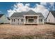 Back exterior view showcasing the deck and the expansive backyard at 6098 Ballard Rd, Denver, NC 28037