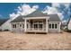 Back exterior view showcasing the deck and the expansive backyard at 6098 Ballard Rd, Denver, NC 28037