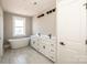 Elegant bathroom featuring dual sinks, soaking tub, and stylish fixtures at 6098 Ballard Rd, Denver, NC 28037