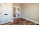 Bedroom with hardwood floors and closet and glass french doors to another room at 6098 Ballard Rd, Denver, NC 28037