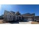 Beautiful single-story home showcasing a neutral color palette, inviting facade, and attached three-car garage at 6098 Ballard Rd, Denver, NC 28037