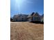 Beautiful single-story home showcasing a neutral color palette, inviting facade, and attached three-car garage at 6098 Ballard Rd, Denver, NC 28037