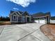 Newly constructed house with gray siding, a concrete driveway, and an attached two-car garage at 6098 Ballard Rd, Denver, NC 28037