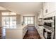 Modern kitchen with a large center island, stainless steel appliances, and bright lighting at 6098 Ballard Rd, Denver, NC 28037