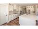 Modern kitchen with white cabinets, a large island, and stainless steel appliances at 6098 Ballard Rd, Denver, NC 28037