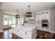 Bright kitchen featuring a central island, modern fixtures, and stainless steel appliances at 6098 Ballard Rd, Denver, NC 28037