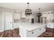 Spacious kitchen with a large white island, modern lighting, and stainless steel appliances at 6098 Ballard Rd, Denver, NC 28037