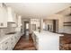 Modern kitchen with white cabinets, a large island, and stainless steel appliances at 6098 Ballard Rd, Denver, NC 28037