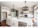 Spacious kitchen and living area featuring an island, fireplace, and stainless appliances at 6098 Ballard Rd, Denver, NC 28037