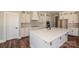 Modern kitchen with white cabinets, a large island, and stainless steel appliances at 6098 Ballard Rd, Denver, NC 28037