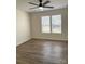 Bright bedroom featuring a window with blinds and warm-toned floors, creating a cozy, inviting space at 6140 Whispering Brook Ct, Charlotte, NC 28216