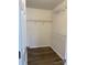 Walk-in closet with ample shelving, providing organized storage and maximizing space at 6140 Whispering Brook Ct, Charlotte, NC 28216