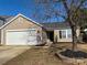 Beautiful single-story home with a wide driveway, attached garage, and manicured landscaping at 6140 Whispering Brook Ct, Charlotte, NC 28216