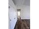 Hallway offers a glimpse of an adjoining room with a large closet and modern flooring at 6140 Whispering Brook Ct, Charlotte, NC 28216