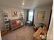 bedroom with crib, chair, and built-in shelving at 620 Cassidy Ct, Clover, SC 29710