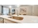 Close-up of a modern kitchen island with stainless steel sink and quartz countertop at 620 Cassidy Ct, Clover, SC 29710