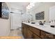 Elegant bathroom with double vanity, soaking tub, and stylish black and white art at 6332 Honor Ave, Midland, NC 28107