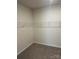 Walk-in closet featuring carpeted floors, white walls, and wire shelving at 6332 Honor Ave, Midland, NC 28107