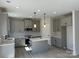 Bright kitchen featuring gray cabinets, a center island with a white countertop, and stainless steel appliances at 6332 Honor Ave, Midland, NC 28107