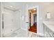 Bathroom with glass shower, white subway tile, marble flooring, and a door leading to a closet at 7191 Three Kings Rd, Fort Mill, SC 29715