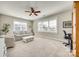 Bedroom with a ceiling fan, carpet, and two windows with white trim framing a picturesque view at 7191 Three Kings Rd, Fort Mill, SC 29715