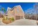 Side exterior view of home featuring a three-car garage and well-maintained landscaping at 7191 Three Kings Rd, Fort Mill, SC 29715