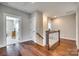 Upstairs hallway showcasing the beautiful hardwood floors and staircase at 7191 Three Kings Rd, Fort Mill, SC 29715