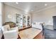 Cozy living room featuring built-in shelving, hardwood floors, and comfortable seating at 7191 Three Kings Rd, Fort Mill, SC 29715