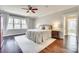 Sunlit main bedroom with a ceiling fan, and large windows with decorative drapes at 7191 Three Kings Rd, Fort Mill, SC 29715