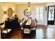 Formal dining room featuring hardwood floors and a large dining table at 7535 Rabbit Cir, Denver, NC 28037