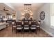 Elegant dining room with stylish lighting and seating, open floor plan at 7535 Rabbit Cir, Denver, NC 28037