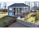 Beautiful two-story home with a screened-in porch, outdoor patio, and a spacious backyard, perfect for outdoor living at 7535 Rabbit Cir, Denver, NC 28037