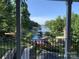 Scenic lake view from a balcony, showcasing calm waters and tree-lined shores at 7535 Rabbit Cir, Denver, NC 28037