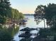 Peaceful lake view with multiple houseboats and docks visible from afar at 7535 Rabbit Cir, Denver, NC 28037