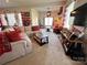 Spacious living area with sectional sofa and large TV at 7535 Rabbit Cir, Denver, NC 28037