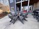 Cozy patio with fire pit and Adirondack chairs at 7535 Rabbit Cir, Denver, NC 28037