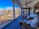 Spacious screened porch with lake views and wicker furniture at 7535 Rabbit Cir, Denver, NC 28037