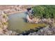 Aerial view of a serene pond surrounded by trees at 821 Bethesda Rd, Statesville, NC 28677