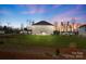 Spacious backyard with a wooden fence, green grass, and a single story home at 821 Bethesda Rd, Statesville, NC 28677