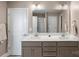 Double vanity bathroom with a large mirror and an adjacent walk-in shower at 821 Bethesda Rd, Statesville, NC 28677