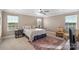 Spacious bedroom with a ceiling fan and ample natural light at 821 Bethesda Rd, Statesville, NC 28677