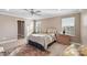 Bright bedroom with a ceiling fan, dresser and natural light at 821 Bethesda Rd, Statesville, NC 28677